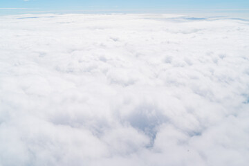 Fototapeta na wymiar 飛行機から見た一面の雲景色 cloud sky view
