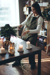 A woman makes a Christmas tree with her own hands. High quality photo