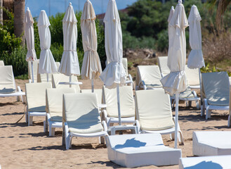 Sunbeds with sun loungers on the beach
