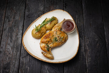 grilled meat with vegetables and spices on a black background
