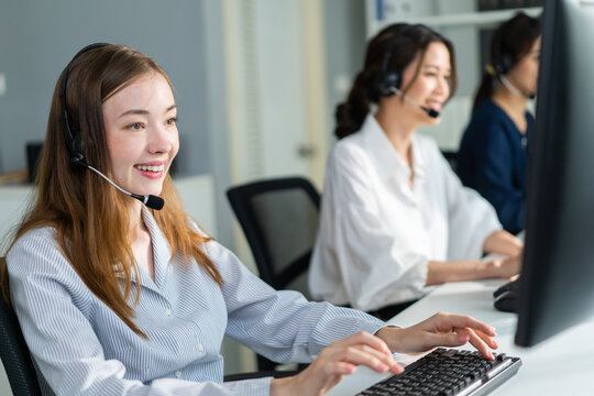 Group of beautiful business woman call center work in office corporate