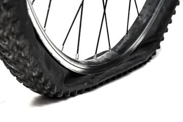 Flat tire bicycle isolated on white background, close up