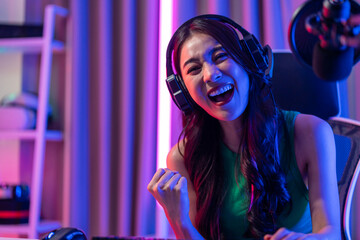 Asian beautiful Esport woman gamer play online video game on computer. © Kawee