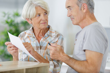 senior couple during furniture assembly