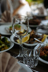 A table with beautiful dishes and prepared dishes on the summer terrace