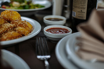A table with beautiful dishes and prepared dishes on the summer terrace