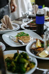 A table with beautiful dishes and prepared dishes on the summer terrace