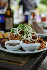 A table with beautiful dishes and prepared dishes on the summer terrace