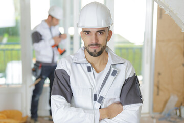 thirty years old manual worker renovating house