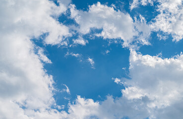 Dramatic blue sky with white clouds.