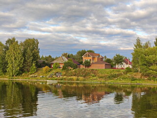 Fototapeta premium Autumn clouds over the Volga village
