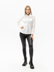 Black leather leggings on white background. Woman in white shirt and black jeggings. Leather pants