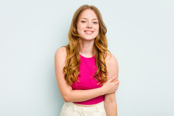 Portrait of pretty young caucasian woman isolated on blue background