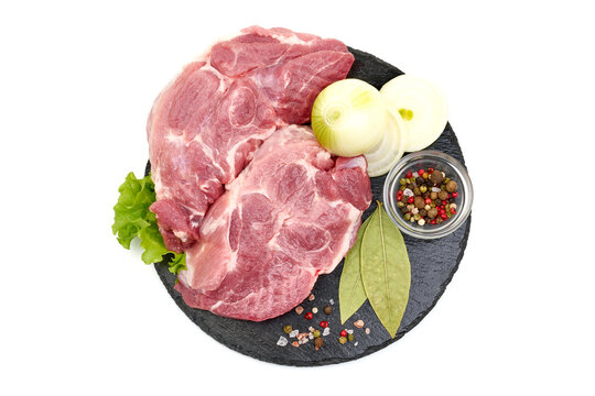 Pork shoulder blade steaks, isolated on white background. High resolution image.