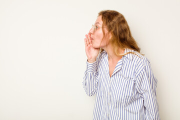 Young caucasian woman isolated on white background is saying a secret hot braking news and looking aside