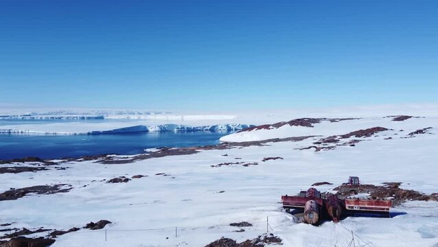 Scientific station Belarusian forwarders. Strong wind blows at the Antarctic station. Extreme tourism cold desert north pole. 