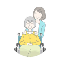 車椅子の母の肩に手を添える娘　介護　親子　母娘