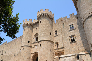 Fototapeta na wymiar medieval castle on greek rhodes island with blue sky on background, front view