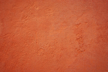 Orange textured background from italian house wall close up.