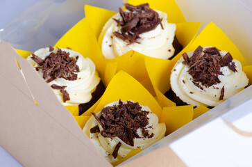 Chocolate cupcakes in box. Unhealthy sweets. Holiday christmas, womens mothers day, happy valentine, february.