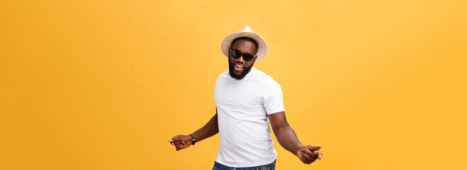 Fototapeta na wymiar Young black man top dancing isolated on a yellow background.