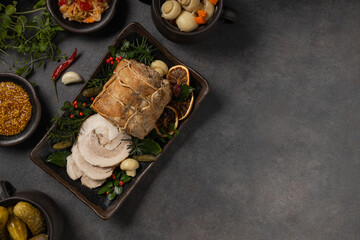 Whole cooked bacon roulade. Tied with a string.