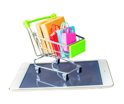 Product package box and shopping bag in cart with tablet which web store shop on screen for online shopping and delivery concept.