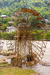 Fototapeta premium view of Water mill in Mu Cang Chai, Yen Bai province, Vietnam in a summer day