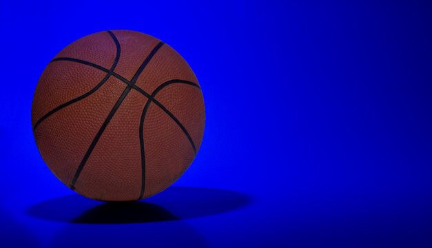 Basket ball on blue light abstract background with copy space