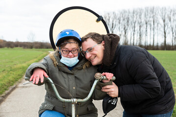 Family portrait of a woman with down syndrome and her brother