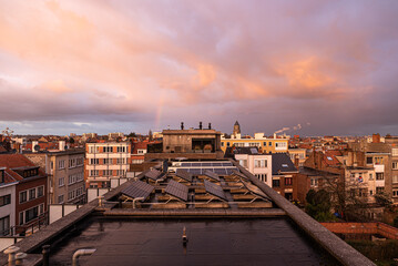 Jette, Brussels, Belgium, Rooftop view over a residential area with a pink reflecting sunset
