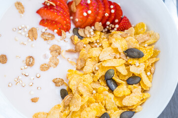 Ripe strawberries, yogurt and cornflakes. Healthy Breakfast Concept