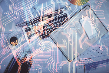 Technology hologram drawing over computer on the desktop background. Top view. Double exposure. Tech concept.