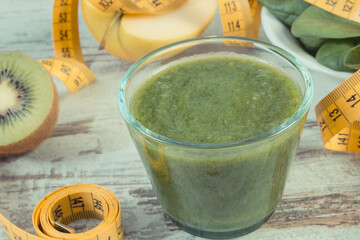 Fresh cocktail from spinach, apple and kiwi. Source vitamins. Slimming and healthy nutrition