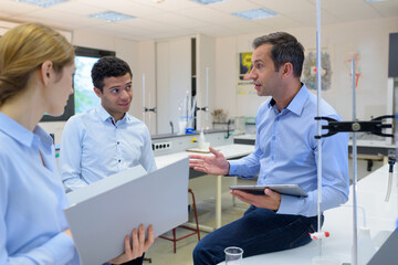 Fototapeta premium professor with student in chemistry class