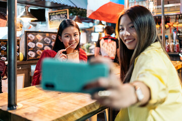 Asian Friends Taking Selfie