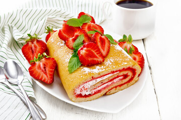 Roll with cream and strawberries in plate on board