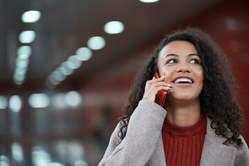 close-up . smiling young woman with a smartphone .