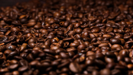 Dark background of roasted coffee beans.