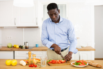 Fototapeta na wymiar Man preparing food at home