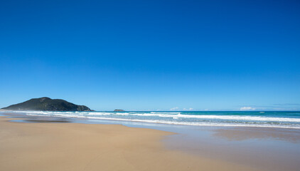 Fototapeta na wymiar Santinho Beach in Florianopolis, Santa Catarina, Brazil.