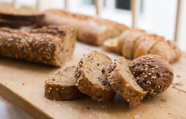 fresh loaf of bread on wooden board
