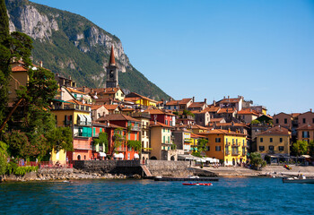 Fototapeta na wymiar Beautiful panorama of lake Como with a small coastal town, famous tourism destination