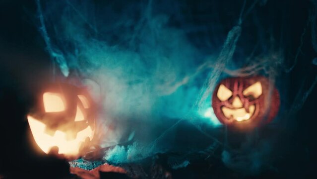 Smoke comes out of the orange halloween pumpkin