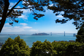 San Francisco view of Oakland Bay bridge and Yerba Buena Island from Coit Tower on a bright sunny summer day. Travelling in the usa NoCal California Nature travel landscape background