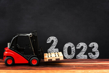 Happy new year 2023. Year 2023 with red forklift
