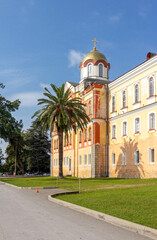 New Athos, Abkhazia - October 17, 2021. The New Athos Monastery with bright golden domes on a sunny autumn day.