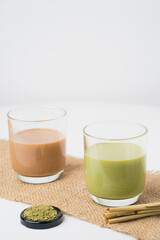 closeup green tea and thai tea with green tea powder on white blackground