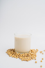 Health Benefits of Soy Milk,Soy milk in glass and soya bean isolated on white background