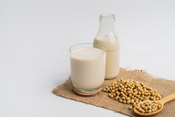 Health Benefits of Soy Milk,Soy milk in glass and soya bean isolated on white background